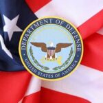 Pentagon Smacked: Judges Claim ‘Animus’ Department of Defense emblem on an American flag background