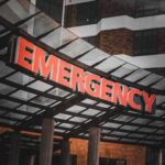 American Doctor Caught In Ebola CHAOS! Illuminated emergency sign at a hospital entrance