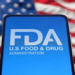Baby Food Panic: Favorite Yanked Nationwide FDA logo displayed on a smartphone with an American flag background