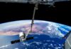 View of Earth from the International Space Station with a satellite in focus