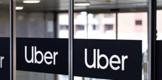 Sign showing Lyft and Uber pickup location.