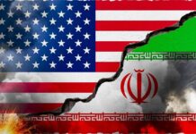 VIDEO: U.S. Attacks — Iranian Tankers Hit A cracked wall displaying the flags of the USA and Iran, symbolizing conflict