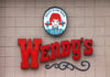 Wendy's restaurant sign on exterior wall
