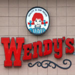 Wendy's restaurant sign on exterior wall