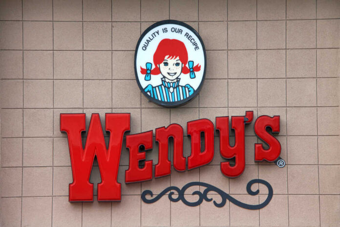Wendy's restaurant sign on exterior wall