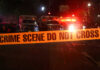 Toddler Dead, Mom Charged — Horrific Details Crime scene tape with emergency vehicles in background.