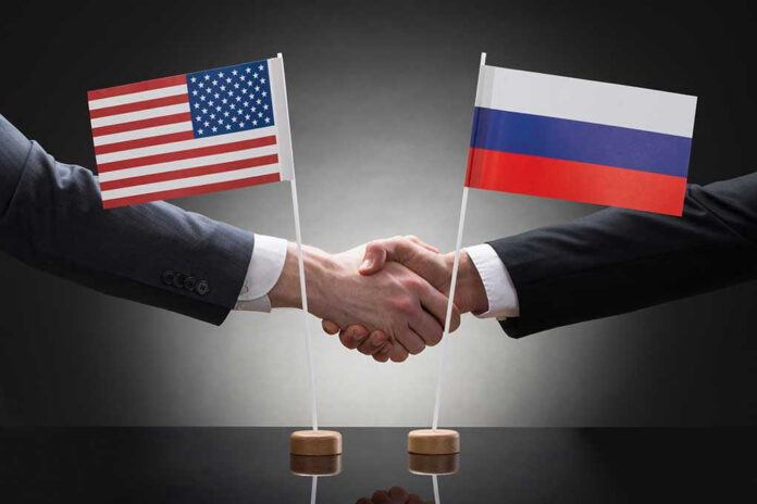 282618053 Handshake with US and Russian flags.