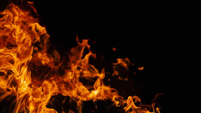 Orange flames against a dark black background