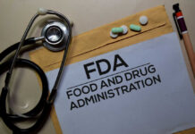 Stethoscope and medication on a folder labeled FDA
