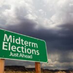 Latino Voters Revolt – Trump Hit Hard green roadside sign against a stormy sky