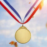 Trump’s Surprise Medal Move Stuns Silicon Valley Gold medal with blue, white, red ribbon, sky background.