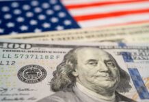 STUNNING: $2M in Seven Weeks Close-up of a hundred dollar bill in front of an American flag
