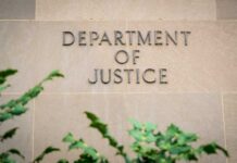 DOJ Drops Election-Crime Bombshell Department of Justice building wall with engraved lettering