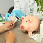 A patient handing cash to a healthcare professional in a medical setting