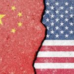 FBI BOMBSHELL: China Spy Caught Cracked surface revealing the flags of China and the USA