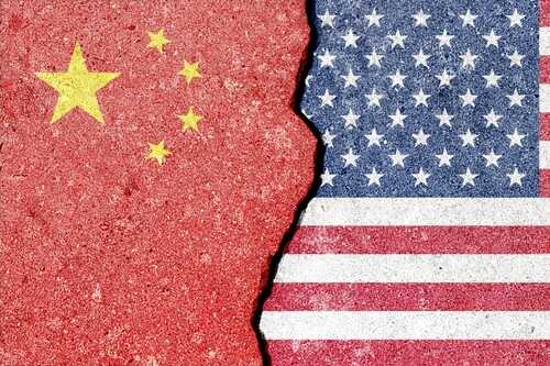 Sino,American,Tension,And,Conflict.,A,Geopolitical,Crack,,Split,Shows Cracked surface revealing the flags of China and the USA