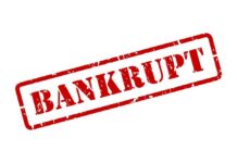 Economic Crunch Triggers Bankruptcy Blitz Red stamp with the word 'BANKRUPT' prominently displayed
