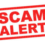 AI-Powered Scams Are Everywhere Now Red stamp with the words SCAM ALERT in bold letters