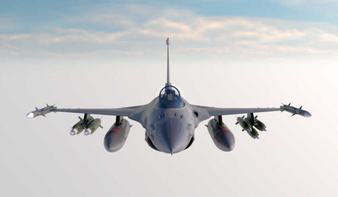 F,-16,,,American,Military,Fighter,Plane.jet,Plane.,Fly,In Fighter jet banking in flight with vapor trails