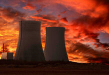 Nuclear Scare Sparks Lockdown – Then What? Nuclear power plant cooling towers at sunset.
